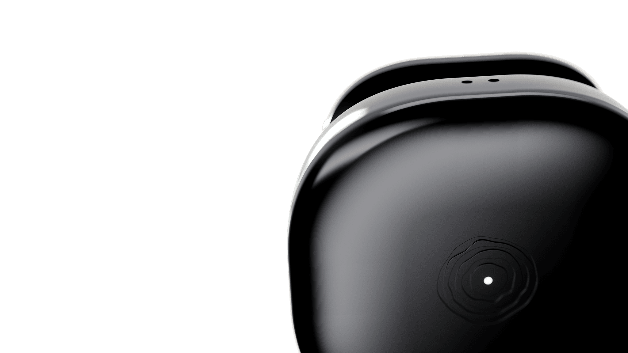 Close-up render of the black Buddi wearable, showing its top microphone ports, clip and green indicator
